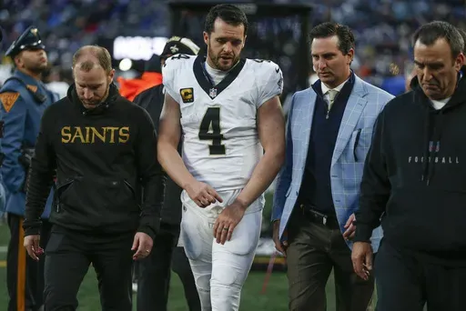New Orleans Saints quarterback Derek Carr (4) walks off the field after an injury during the fourth quarter of an NFL football game against the New York Giants, Sunday, Dec. 8, 2024, in East Rutherford, N.J. (AP Photo/John Munson)
