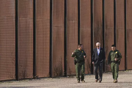 President Joe Biden walks with U.S. Border Patrol agents along a stretch of the U.S.-Mexico border in El Paso Texas, Sunday, Jan. 8, 2023. A new poll by The Associated Press-NORC Center for Public Affairs Research shows some support for changing the number of immigrants and asylum-seekers allowed into the country. About 4 in 10 U.S. adults say the level of immigration and asylum-seekers should be lowered, while about 2 in 10 say they should be higher, according to the poll. About a third want th