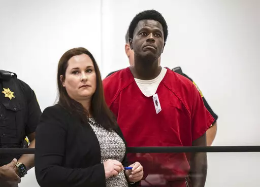 Wesley Brownlee stands with public defender Allison Nobert during his arraignment in San Joaquin County Superior Court on Tuesday, Oct. 18, 2022. Brownlee has been charged in four additional slayings this week, bringing his total to seven deaths in Northern California since April 2021, authorities said. (Hector Amezcua/The Sacramento Bee via AP,File)/The Sacramento Bee via AP, File)