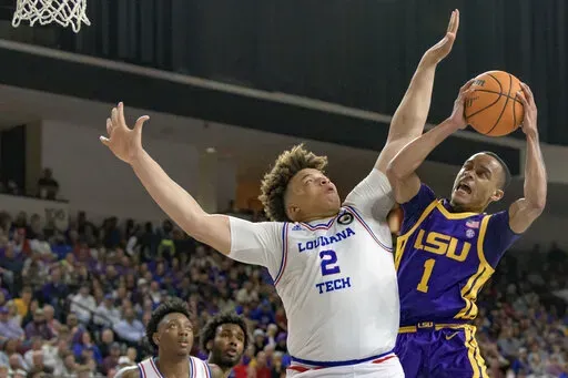 LSU guard Xavier Pinson (1) shoots against Louisiana Tech forward Kenneth Lofton Jr. (2) during the second half of an NCAA college basketball game in Bossier City, La., Saturday, Dec. 18, 2021. (AP Photo/Matthew Hinton)