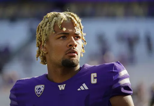 Washington wide receiver Rome Odunze looks into the stands after an NCAA college football game against Tulsa, Sept. 9, 2023, in Seattle. Odunze, who played the middle portion of the year with a broken rib and finished the year as a first-team All-American on seemingly every list, will face No. 3 Texas in the Sugar Bowl Monday, Jan. 1, 2024. (AP Photo/Lindsey Wasson, File)