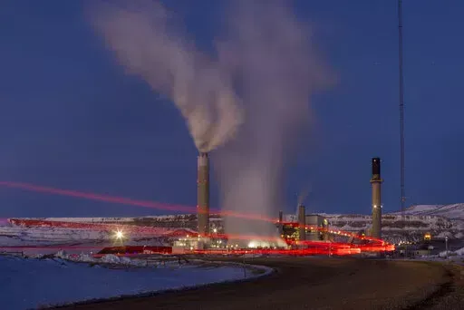Taillights trace the path of a motor vehicle at the Naughton Power Plant, Jan. 13, 2022, in Kemmerer, Wyo. The Supreme Court decision June 30, restricting the authority of the Environmental Protection Agency may mean continued pollution from power plants in states that are not switching to cleaner energy. But many states are switching and experts say they'll remain free to keep cleaning up their electrical grids under the new decision. (AP Photo/Natalie Behring, File)