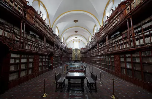 The interior of Palafoxiana library in Puebla, Mexico, Tuesday, Sept. 13, 2022. It is the oldest public library in the Americas, according to UNESCO. (AP Photo/Pablo Spencer)