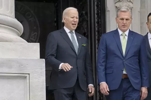 President Joe Biden talks with House Speaker Kevin McCarthy, R-Calif., as he departs the Capitol following the annual St. Patrick's Day gathering, in Washington, March 17, 2023. Facing the risk of a federal government default as soon as June 1, President Joe Biden has invited the top four congressional leaders to a White House meeting on May 9 for talks. It’s the first concrete step toward negotiations on averting a potential economic catastrophe, but there’s a long way to go: Biden and Repu