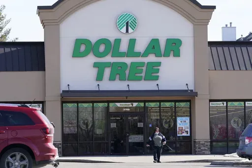 A woman leaves a Dollar Tree store in Urbandale, Iowa, on Feb. 25, 2021. (AP Photo/Charlie Neibergall, file)