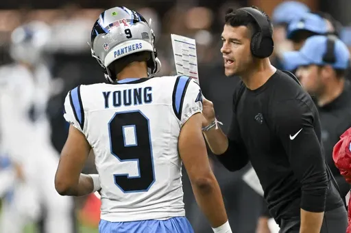 Carolina Panthers head coach Dave Canales right talks to quarterback Bryce Young (9) during the second half of an NFL football game against the New Orleans Saints, Sunday, Sept. 8, 2024, in New Orleans. (AP Photo/Matthew Hinton)