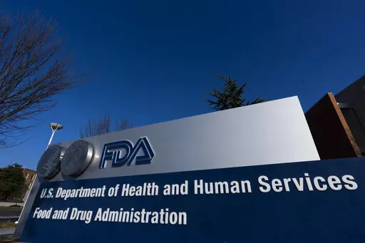 A sign in front of the Food and Drug Administration building is seen on Dec. 10, 2020, in Silver Spring, Md. Expedited drug approvals slowed in 2022, as the FDA's controversial accelerated pathway came under new scrutiny from Congress, government watchdogs and some of the agency’s own leaders. With less than a month remaining in the year, the agency’s drug center has granted 10 accelerated approvals — fewer than the tally in each of the last five years, when use of the program reached all-