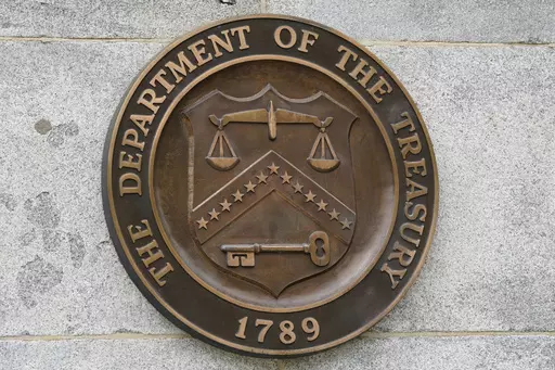 The Department of the Treasury's seal outside the Treasury Department building in Washington on May 4, 2021. The United States has slapped more sanctions on people and firms associated with Iran and with what it calls an illicit banking network used to conceal transactions. The U.S. said Thursday it placed the penalties on 39 firms linked to a shadow banking system that helped to muddy financial activity between sanctioned Iranian firms and foreign buyers, namely for petrochemicals. (AP Photo/Pa
