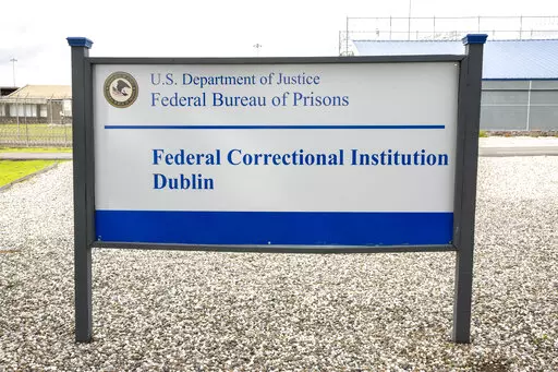 A sign for the Federal Correctional Institution Dublin is displayed on Jan. 9, 2019, in Dublin, Calif. A government watchdog has found a “substantial likelihood” the federal Bureau of Prisons committed wrongdoing when it ignored complaints and failed to address asbestos and mold contamination at the federal women’s prison that has already been under scrutiny for rampant sexual abuse of inmates. (Santiago Mejia/San Francisco Chronicle via AP, File)