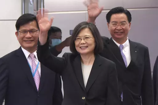 In this image made from video, Taiwan's Presidential office secretary general Lin Chia-lung, left, President Tsai Ing-wen, center, and Foreign Minister Joseph Wu wave before Tsai's departure on an overseas trip at Taoyuan International Airport in Taipei, Taiwan, Wednesday, March 29, 2023. China has threatened "resolute countermeasures" over a planned meeting between Taiwanese President Tsai Ing-wen and Speaker of the United States House Speaker Kevin McCarthy during an upcoming visit in Los Ange