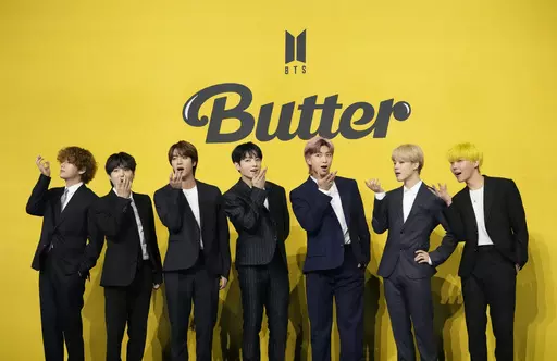 Members of South Korean K-pop band BTS, V, SUGA, JIN, Jung Kook, RM, Jimin, and j-hope from left to right, pose for photographers ahead of a news conference to introduce their new single "Butter" in Seoul, South Korea, May 21, 2021. The speculation over an untitled book can end, and it is BTS fans, not followers of Taylor Swift, who can rejoice. Flatiron Books announced Thursday, May 11, 2023, the book “4C Untitled Flatiron Nonfiction Summer 2023” was in fact about the mega-popular South Kor