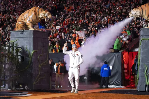 Cincinnati Bengals quarterback Joe Burrow enters the field during the Super Bowl LVI Opening Night Fan Rally, Monday, Feb. 7, 2022, in Cincinnati. (AP Photo/Jeff Dean)