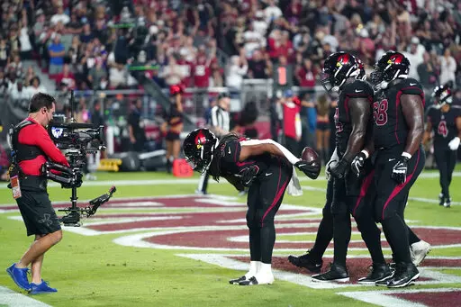Arizona Cardinals running back Keaontay Ingram (30) celebrate his touchdown during the first half of an NFL football game against the New Orleans Saints, Thursday, Oct. 20, 2022, in Glendale, Ariz. (AP Photo/Ross D. Franklin)