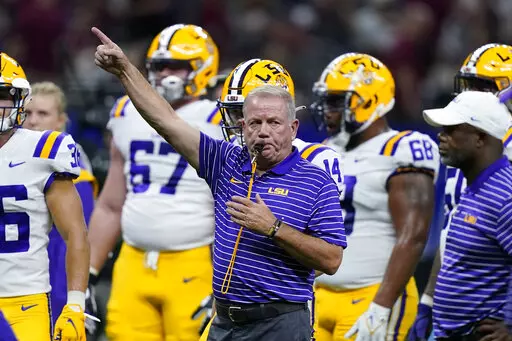 LSU head coach Brian Kelly blows his whistle before an NCAA college football game against Florida State in New Orleans, Sunday, Sept. 4, 2022. (AP Photo/Gerald Herbert)