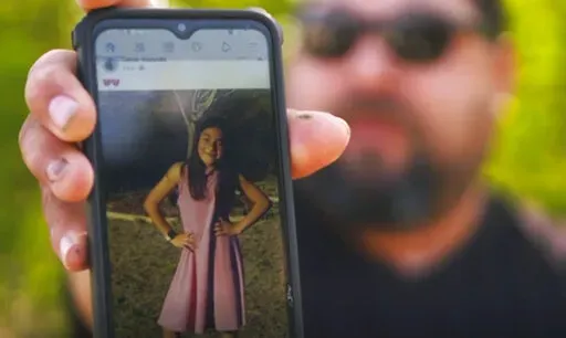 In this image from video, Javier Cazares shows a picture of his daughter, Jackie Cazares, Thursday, May 26, 2022, in Uvalde, Texas. Jackie, 9, was among the 19 children and two teachers killed during a mass shooting at Robb Elementary School on Tuesday. (AP Photo/Robert Bumsted)