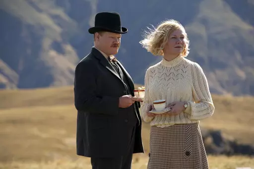 This image released by Netflix shows Jesse Plemons, left, and Kirsten Dunst in a scene from "The Power of the Dog." (Kirsty Griffin/Netflix via AP)