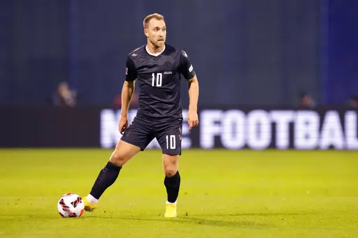 Denmark's Christian Eriksen in action during the UEFA Nations League soccer match between Croatia and Denmark at the Maksimir stadium in Zagreb, Croatia, on Sept. 22, 2022. Denmark will wear team jerseys at the World Cup that protest the human rights record of host nation Qatar, with a black option to honor migrant workers who died during construction work for the tournament. “The color of mourning,” kit manufacturer Hummel said when releasing the black third-choice design. (AP Photo/Darko B