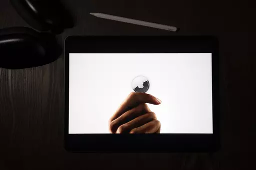 In this illustration photographed in La Habra, Calif., the AirTag tracking device is introduced during a virtual event held to announce new Apple products, Tuesday, April 20, 2021. On Friday, March 15, 2024, U.S. judge has denied Apple's motion to dismiss a class-action lawsuit claiming that stalkers are using AirTag devices to track victims — and that the tech giant hasn't done enough to prevent it. (AP Photo/Jae C. Hong, File)