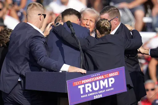 Republican presidential candidate former President Donald Trump is surrounded by Secret Service at a campaign event in Butler, Pa., July 13, 2024. Few Americans have high confidence in the Secret Service's ability to keep presidential candidates safe after last month's attempt on Trump's life. That is according to a new poll conducted July 25-29, 2024, from the AP-NORC Center for Public Affairs Research. Only around three in 10 Americans are extremely or very confident that the Secret Service ca