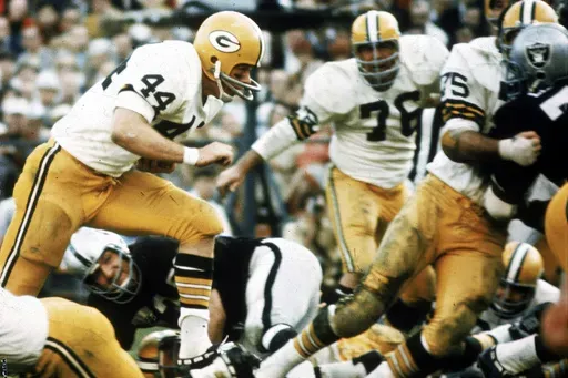 Green Bay Packers running back Donny Anderson (44) finds a hole in the Oakland Raiders defense and scores a touchdown during Super Bowl II at the Orange Bowl in Miami, Fla., on Sunday, Jan. 14, 1968. (AP Photo/File)
