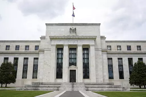 This May 4, 2021, file photo shows the Federal Reserve building in Washington. The Federal Reserve is poised this week to begin unleashing its most drastic steps in three decades to attack inflation by making it costlier to borrow — for a car, a home, a business deal, a credit card purchase — all of which will compound Americans' financial strains and likely weaken the economy. The Fed is expected to announce Wednesday, May 3, 2022 that it will begin quickly shrinking its vast stockpile of T