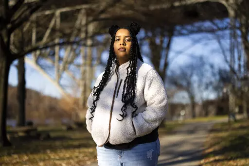 High school student Mecca Patterson-Guridy, 17, poses for a portrait in Philadelphia, Friday, Dec. 9, 2022. Scrutiny from conservatives around teaching about race, gender and sexuality has made many teachers reluctant to discuss issues that touch on cultural divides. To fill in gaps, some students, including Mecca, are looking to social media, where online personalities, nonprofit organizations and teachers are experimenting with ways to connect with them outside the confines of school. (AP Phot
