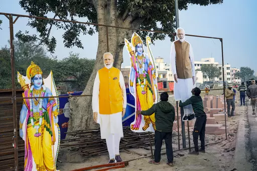 Workers put up cutouts of Hindu deity Lord Ram and Indian Prime Minister Narendra Modi to mark the opening of a grand temple for Lord Ram in Ayodhya, India, Thursday, Jan. 18, 2024. Coming ahead of the upcoming national elections, the ceremony has welded into a potent mix of religion and statecraft that analysts say will secure an enduring, though contentious legacy for Modi who is seeking a third-consecutive term. (AP Photo/Deepak Sharma, File)