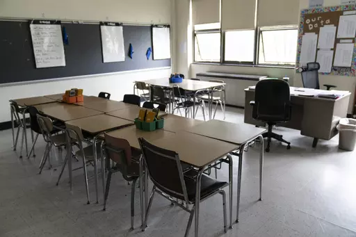 Desks fill a classroom in a high school in Pennsylvania on Wednesday, May 3, 2023. Gaps between how minority students perform academically in comparison to their white peers have long been an issue across the country. The disparities often stem from larger structural issues — a lack of access to quality curricula, for instance, or teachers expecting students to perform poorly. (AP Photo/Matt Rourke, File)