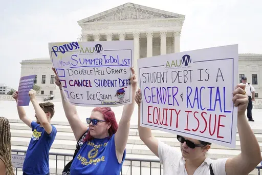 People demonstrate outside the Supreme Court, June 30, 2023, in Washington. (AP Photo/Jacquelyn Martin, File)
