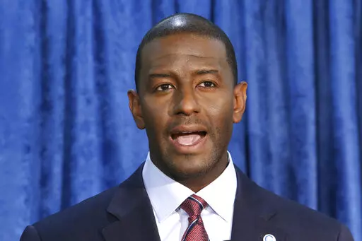 In this Nov. 10, 2018 file photo, Andrew Gillum, then-Democratic candidate for governor, speaks at a news conference in Tallahassee, Fla. Gillum, the 2018 Democratic nominee for Florida governor, is facing 21 federal charges related to a scheme to seek donations and funnel a portion of them back to him through third parties. The U.S. attorney's office announced the indictment Wednesday, June 22, 2022.  (AP Photo/Steve Cannon, File)