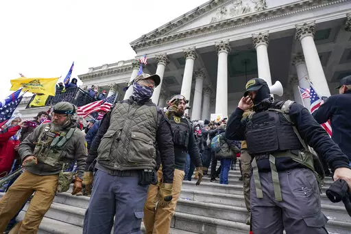 Members of the Oath Keepers stand on the East Front of the U.S. Capitol on Jan. 6, 2021, in Washington. The trial of the founder of the Oath Keepers, Stewart Rhodes, and four associates charged with seditious conspiracy in the attack on the U.S. Capitol is set to begin next week. (AP Photo/Manuel Balce Ceneta, File)