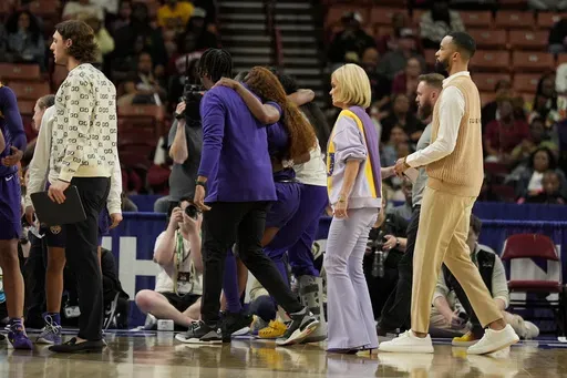 LSU guard Aneesah Morrow is helped off the court during the second half during of an NCAA college basketball game against Texas in the semifinals of the Southeastern Conference tournament, Saturday, March 8, 2025, in Greenville, S.C. (AP Photo/Chris Carlson)