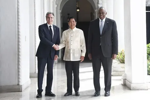 Philippine President Ferdinand Marcos Jr., center, greets U.S. Secretary of State Antony Blinken, left, and U.S. Secretary of Defense Lloyd Austin at the Malacanang presidential palace in Manila, Philippines on Tuesday, July 30, 2024. (AP Photo/Basilio Sepe, Pool)