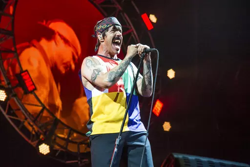 Anthony Kiedis of the Red Hot Chili Peppers performs at the Bonnaroo Music and Arts Festival on Saturday, June 10, 2017, in Manchester, Tenn. Organizers of this year's New Orleans Jazz Fest say the band Red Hot Chili Peppers has been added to the lineup of the 2022 event. The festival said Friday, April 8, 2022, that the appearance is set for Sunday, May 1, and will be the group's first performance at Jazz Fest since 2016. (Photo by Amy Harris/Invision/AP, File)