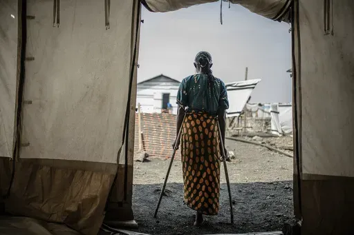 The 42-year-old mother of four who was raped in the Bulengo displacement camp where she had fled war in eastern Congo poses for a photograph Aug. 23, 2023. Hundreds of thousands of women and girls have been displaced over the past year in eastern Congo amid fighting by more than 130 armed groups. That leaves them vulnerable to sexual assault, which is on the rise. French aid group Doctors Without Borders says more than twice as many women in recent months have sought treatment for sexual assault