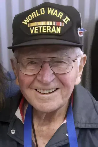 This undated photo provided by the National WWII Museum, shows World War II Navy veteran Robert "Al" Persichitti, of Fairport, N.Y. Persichitti is being mourned, Thursday, June 6, 2024, after his death en route to France to commemorate the 80th anniversary of D-Day. Persichitti fell ill during a stop in Germany the previous week and died in a hospital, his longtime priest and friend, the Rev. William Leone, said. Persichitti was 102. (Courtesy of The National WWII Museum via AP)