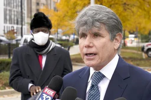 Former Illinois Gov. Rod Blagojevich, right, speaks, Oct. 21, 2020, during a news conference in Chicago. (AP Photo/Charles Rex Arbogast, File)