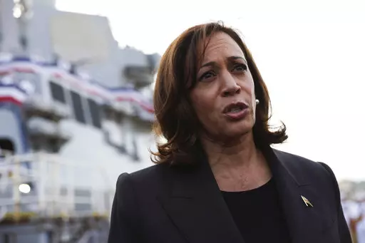 U.S. Vice President Kamala Harris talks to the media at Yokosuka Naval Base, in Yokosuka, near Tokyo, Wednesday, Sept. 28, 2022. Standing on the deck of an American destroyer at a naval base here on Wednesday, Vice President Kamala Harris directly challenged China by pledging that the United States would “continue to deepen our unofficial ties” to the disputed island of Taiwan. (Leah Millis/Pool Photo via AP)