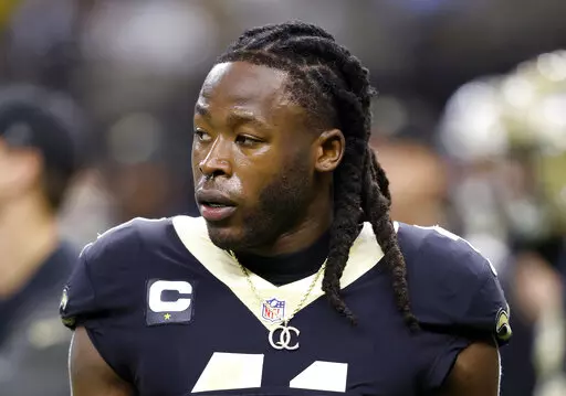 New Orleans Saints running back Alvin Kamara warms up for the team's NFL football game against the Las Vegas Raiders, Oct. 30, 2022, in New Orleans. Kamara, Cincinnati Bengals cornerback Chris Lammons and co-defendants Darrin Young and Percy Harris pleaded not guilty in state court in Nevada on Thursday March 2, 2023, to charges they beat a man unconscious at a Las Vegas Strip nightclub before the NFL’s 2022 Pro Bowl. (AP Photo/Tyler Kaufman, File)