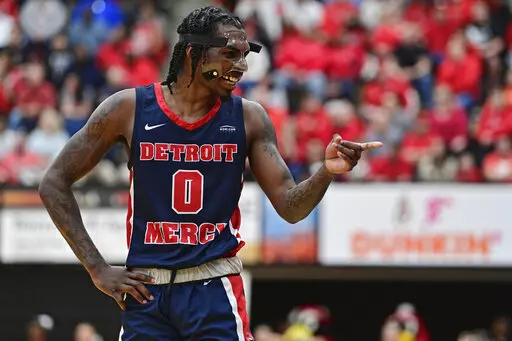 Detroit Mercy guard Antoine Davis smiles while talking with fans during the second half of an NCAA college basketball game against Youngstown State in the quarterfinals of the Horizon League tournament Thursday, March 2, 2023, in Youngstown, Ohio. (AP Photo/David Dermer)