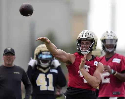 New Orleans Saints quarterback Derek Carr runs through drills at the team's NFL football minicamp in Metairie, La., June 15, 2023. New quarterback Carr and the return of receiver Michael Thomas have the Saints optimistic about an improvement on offense as training camp arrives. (AP Photo/Gerald Herbert, File)