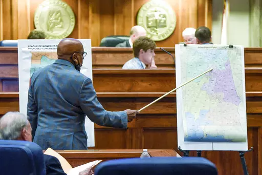 Sen. Rodger Smitherman compares U.S. Representative district maps during the special session on redistricting at the Alabama Statehouse in Montgomery, Ala., on Nov. 3, 2021. The Supreme Court has put on hold a lower court ruling that Alabama must draw new congressional districts before the 2022 elections, boosting Republican chances to hold six of the state’s seven seats in the House of Representatives.  (Mickey Welsh/The Montgomery Advertiser via AP, File)