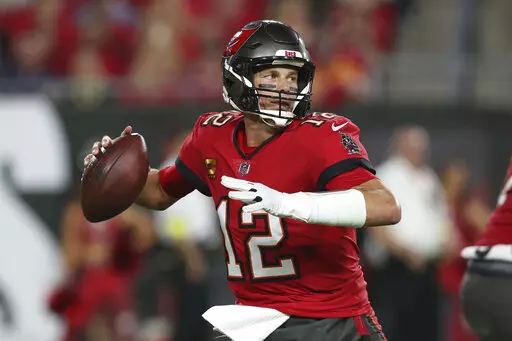 Tampa Bay Buccaneers quarterback Tom Brady (12) drops back to pass in the first half of an NFL football game against the New Orleans Saints in Tampa, Fla., Monday, Dec. 5, 2022. (AP Photo/Mark LoMoglio)