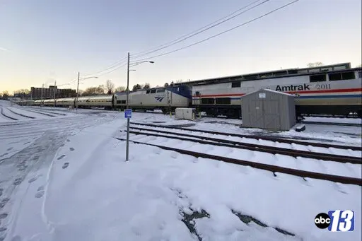 In this image taken from video and provided by WSET-TV, ABC 13, the Amtrak Crescent train number 20 traveling from New Orleans to New York on Tuesday, Jan. 4, 2022, remains in Lynchburg, Va., after inclement weather and power outages in Northern Virginia. (Madison Doner/WSET-TV, ABC 13