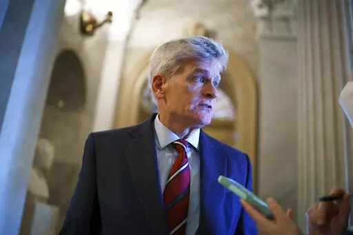 Sen. Bill Cassidy, R-La., pauses outside the chamber during a confirmation vote, at the Capitol in Washington, Oct. 5, 2021. Both of the state's U.S. senators, Cassidy and Sen. John Kennedy say they have mulled over the option of running for governor and plan on announcing their decisions for 2023. (AP Photo/J. Scott Applewhite, File)