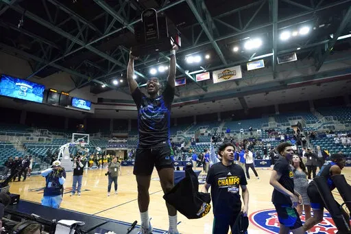 Texas A&M Corpus Christi's Myles Smith celebrates after the Southland Conference tournament NCAA college basketball game final against the Southeastern Louisiana Saturday, March 12, 2022, in Katy, Texas. Texas A&M Corpus Christi won 73-65.(AP Photo/David J. Phillip)