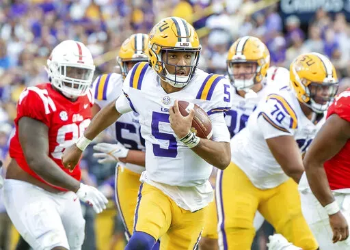 LSU quarterback Jayden Daniels scores a touchdown agaanst Mississippi during an NCAA college football game at Tiger Stadium in Baton Rouge, La, Saturday, Oct. 22, 2022. (Scott Clause/The Daily Advertiser via AP)