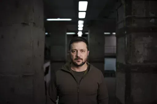 Ukrainian President Volodymyr Zelenskyy poses for a photo after his interview with The Associated Press in Kharkiv, Ukraine, Thursday, Nov. 30, 2023. Zelenskyy says the war with Russia is in a new stage, with winter expected to complicate fighting after a summer counteroffensive that failed to produce desired results due to enduring shortages of weapons and ground forces. Despite the setbacks, however, he says that "we are not backing down." (AP Photo/Felipe Dana)