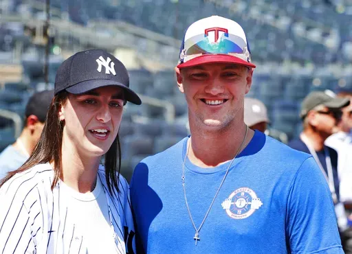 WNBA basketball player Caitlin Clark and Texas Rangers Josh Jung are photographed before a baseball double header game between the New York Yankees and the Texas Rangers, Saturday, Aug. 10, 2024 in New York. (AP Photo/Noah K. Murray)