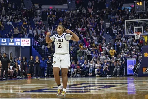 LSU guard Mikaylah Williams (12) celebrates after a jumper late in the fourth quarter to send an NCAA college basketball game against Stanford into overtime Thursday, Dec. 5, 2024, in Baton Rouge, La. (AP Photo/Matthew Hinton)